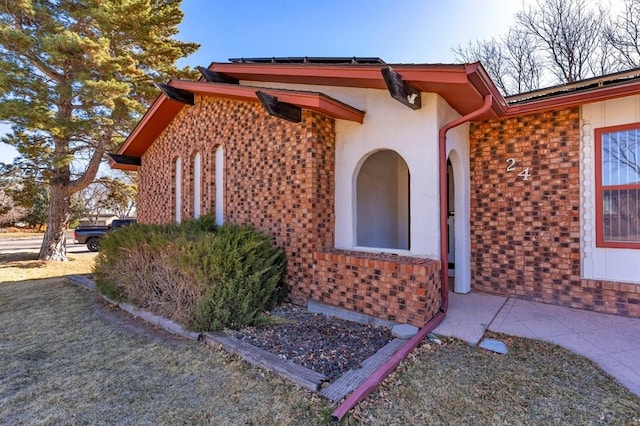 property entrance with brick siding