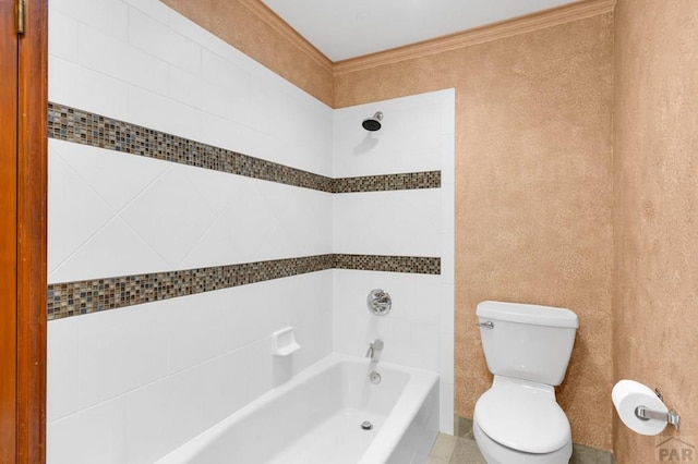 bathroom featuring tub / shower combination, toilet, and ornamental molding