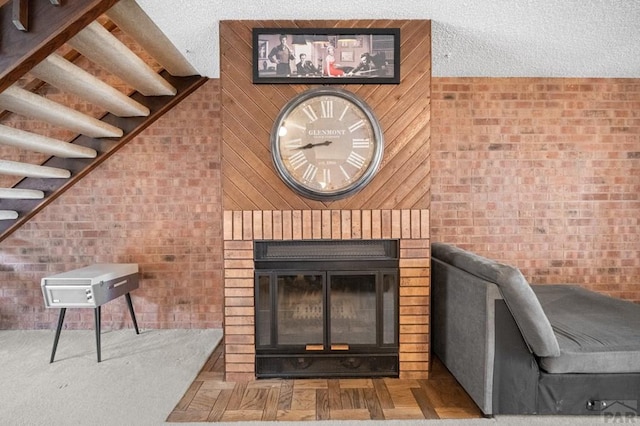 interior space featuring brick wall and a fireplace