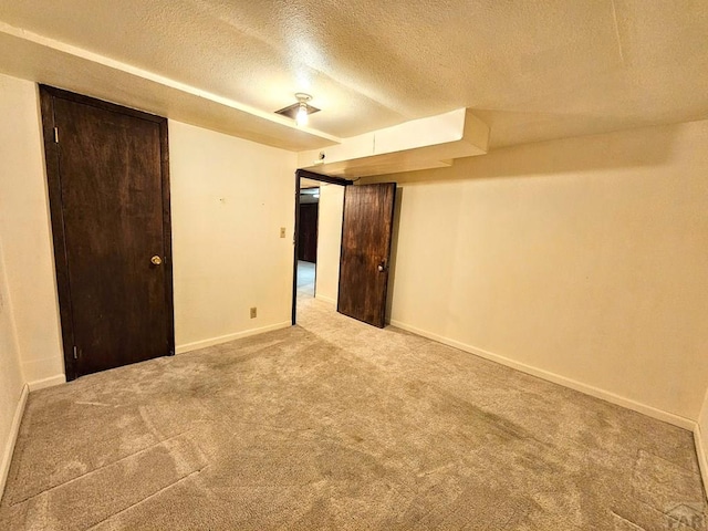 3112 Withers Ave, Pueblo, CO 81008 - unfurnished bedroom with a textured ceiling, carpet, and baseboards