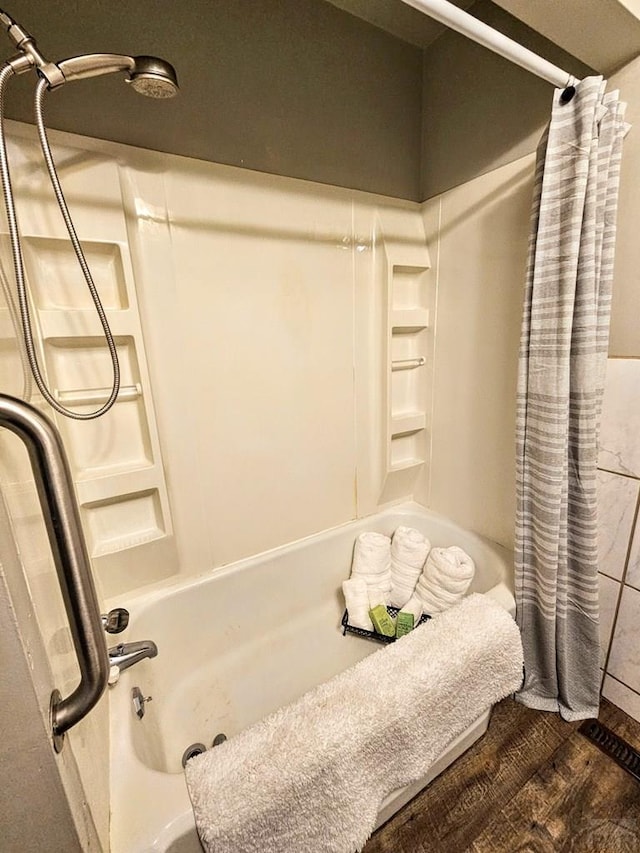 3112 Withers Ave, Pueblo, CO 81008 - bathroom with shower / tub combo with curtain and wood finished floors