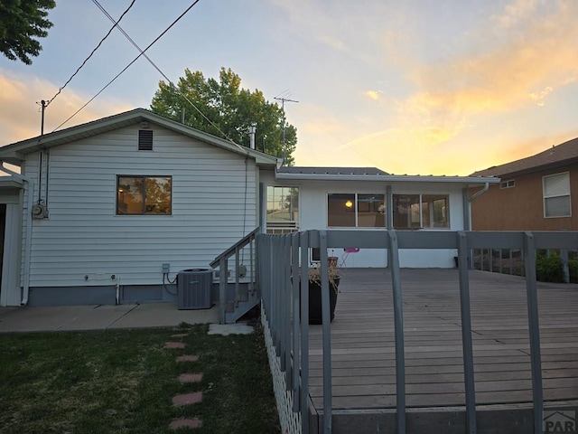 3112 Withers Ave, Pueblo, CO 81008 - back of house with central AC and a wooden deck