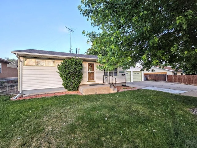 3112 Withers Ave, Pueblo, CO 81008 - view of front of property featuring concrete driveway and a garage