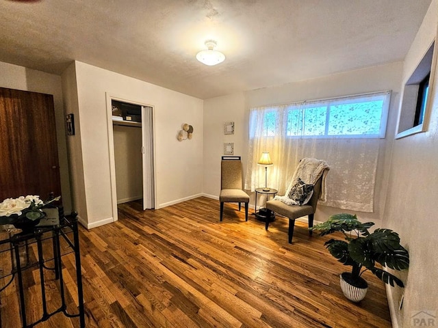 3112 Withers Ave, Pueblo, CO 81008 - sitting room with wood finished floors and baseboards
