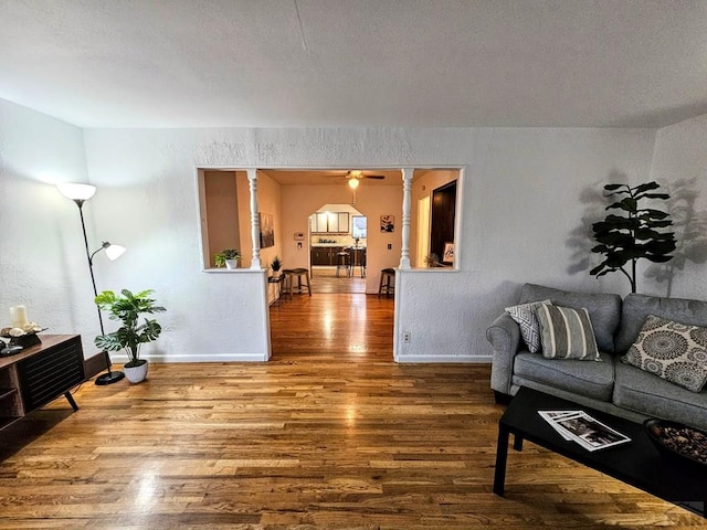3112 Withers Ave, Pueblo, CO 81008 - living room featuring wood finished floors, baseboards, and ceiling fan