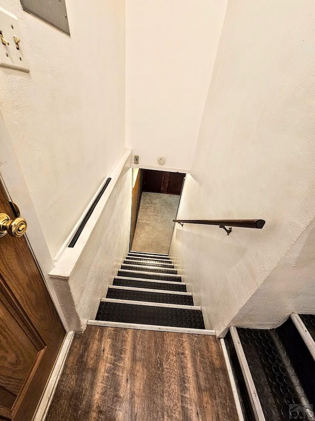 3112 Withers Ave, Pueblo, CO 81008 - staircase featuring wood finished floors
