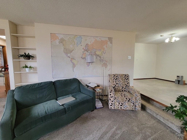 carpeted living area with baseboards and a textured ceiling