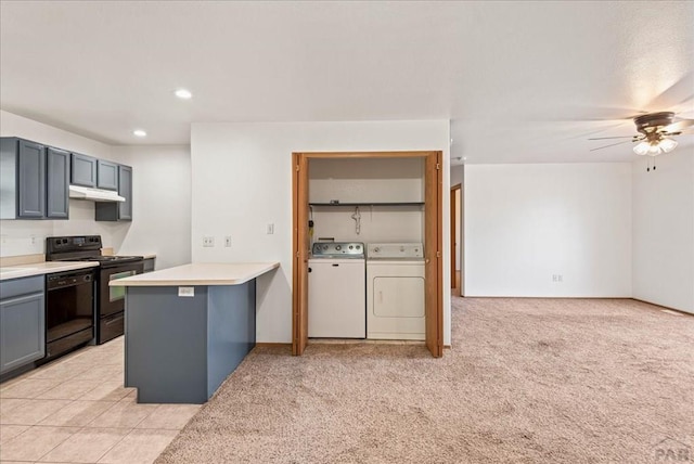 kitchen with under cabinet range hood, a peninsula, black dishwasher, light countertops, and electric stove