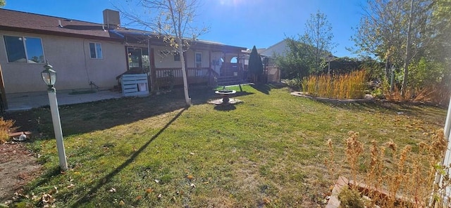 view of yard with a wooden deck