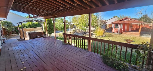 wooden terrace with a storage shed, a hot tub, a yard, an outdoor structure, and a pergola