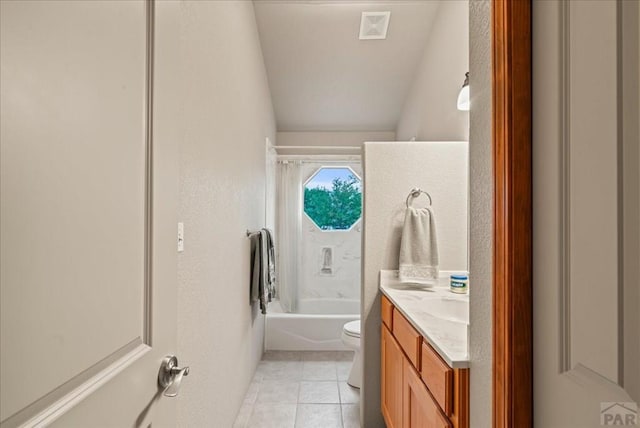 bathroom featuring visible vents, toilet, tile patterned flooring, vanity, and washtub / shower combination