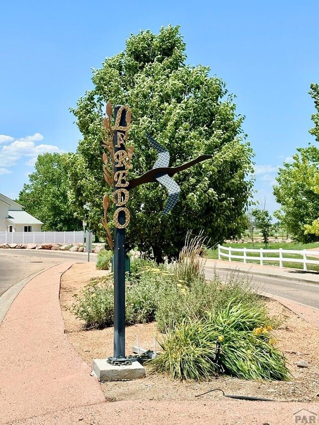 view of community with fence