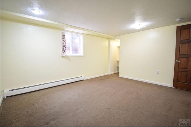 below grade area featuring a baseboard radiator, carpet flooring, and baseboards