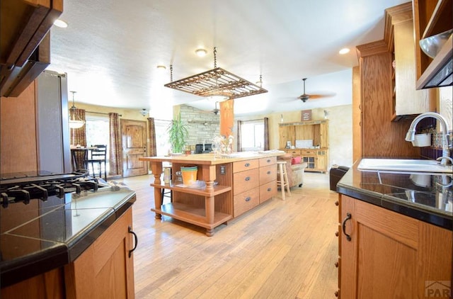 kitchen featuring recessed lighting, a sink, a ceiling fan, light wood-type flooring, and open shelves