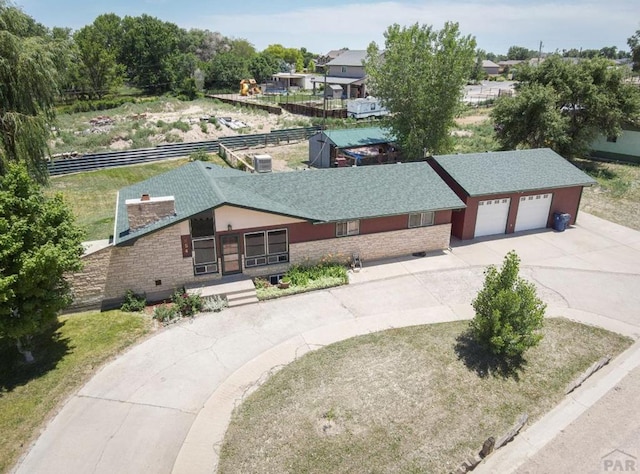 view of front of home featuring a garage and concrete driveway