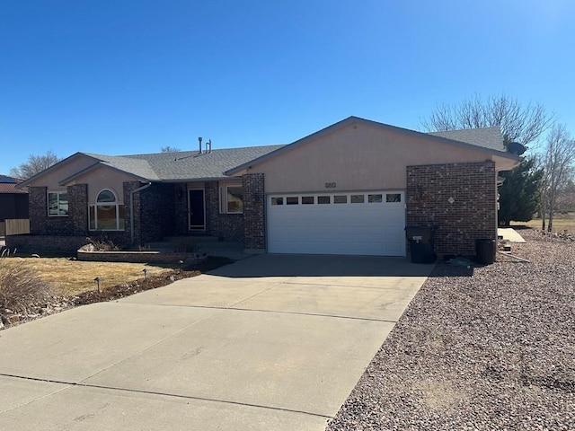 ranch-style home with driveway, brick siding, an attached garage, and a shingled roof