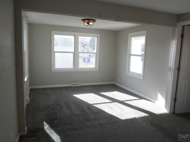 3023 Cascade Ave, Pueblo, CO 81008 - carpeted empty room featuring baseboards and visible vents