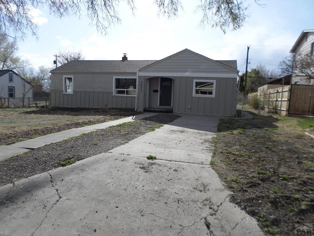 3023 Cascade Ave, Pueblo, CO 81008 - single story home with board and batten siding, fence, driveway, and roof with shingles