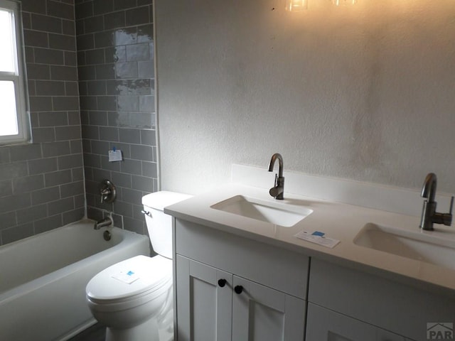 3023 Cascade Ave, Pueblo, CO 81008 - full bathroom featuring a sink, toilet, double vanity, and tub / shower combination