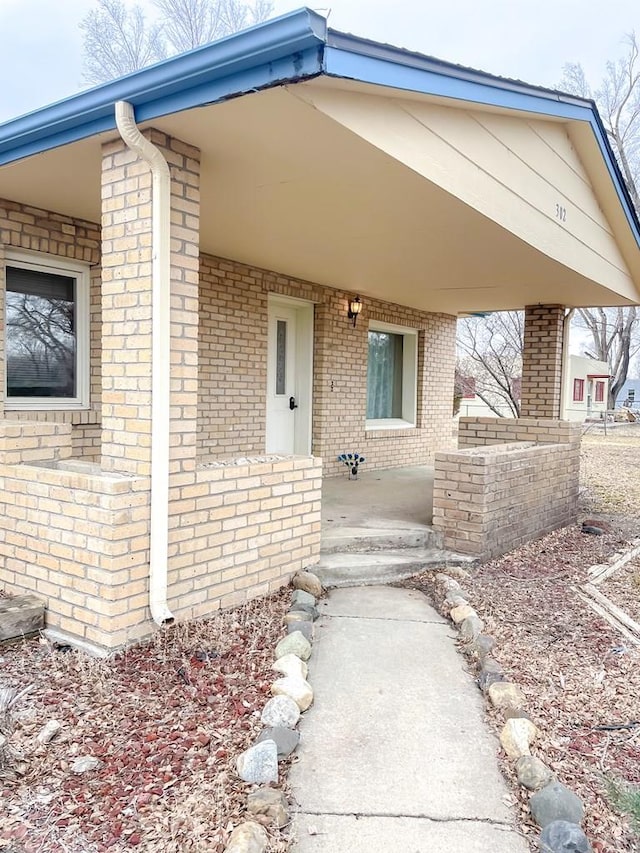 entrance to property with brick siding