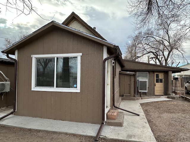 view of property exterior with a patio area