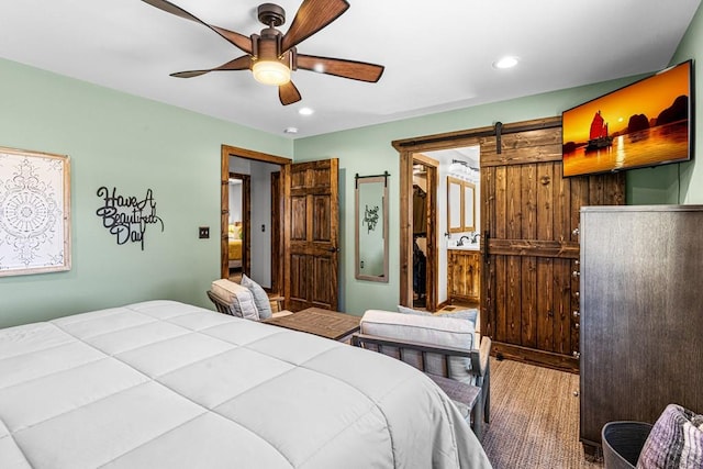 1401 Larkspur Ln, Westcliffe, CO 81252 - bedroom featuring recessed lighting, a barn door, wood finished floors, and ceiling fan
