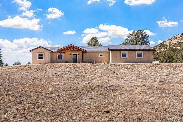 1401 Larkspur Ln, Westcliffe, CO 81252 - single story home with stucco siding and metal roof