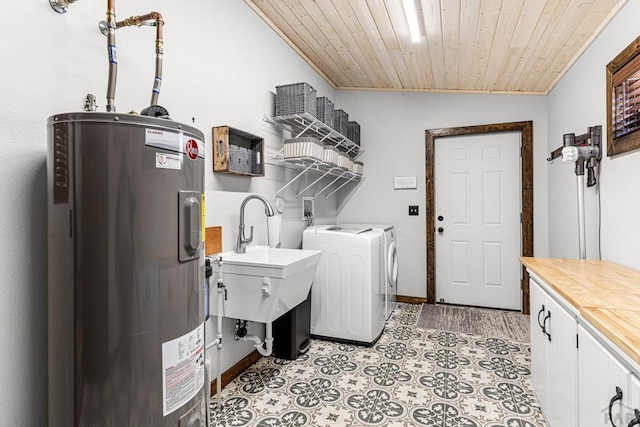 1401 Larkspur Ln, Westcliffe, CO 81252 - laundry room featuring baseboards, washing machine and clothes dryer, cabinet space, water heater, and wood ceiling