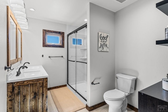 1401 Larkspur Ln, Westcliffe, CO 81252 - bathroom with baseboards, toilet, double vanity, recessed lighting, and a stall shower