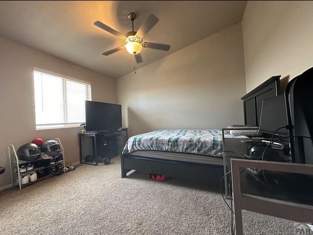 1427 E Kiva Dr, Pueblo West, CO 81007 - bedroom with vaulted ceiling, carpet floors, and a ceiling fan