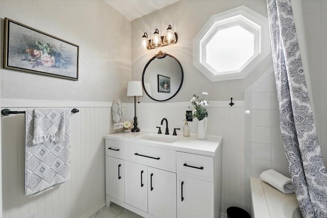 433-435 E Stardust Dr, Pueblo West, CO 81007 - bathroom featuring vanity, a wainscoted wall, and shower / bathtub combination with curtain