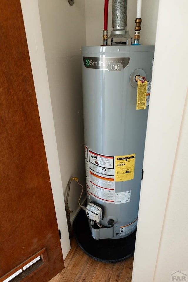 utility room featuring water heater