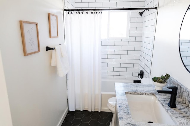 bathroom featuring shower / bath combo, vanity, toilet, and tile patterned floors