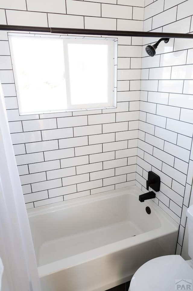 full bath with bathing tub / shower combination and toilet