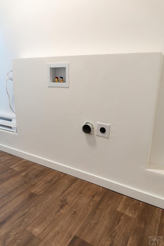 clothes washing area featuring laundry area, dark wood-style flooring, hookup for a washing machine, and baseboards