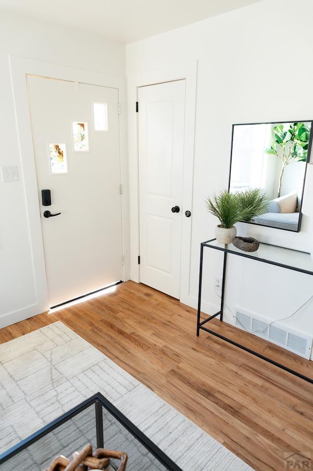 interior space featuring visible vents and light wood-style flooring