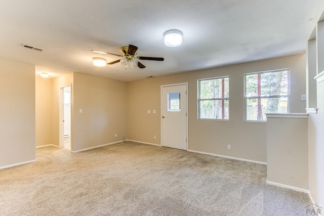 319 S Main St, La Veta, CO 81055 - spare room featuring ceiling fan, light carpet, and baseboards