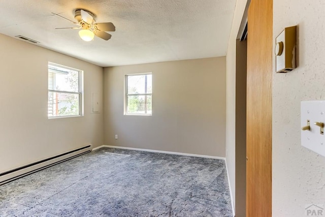 319 S Main St, La Veta, CO 81055 - carpeted spare room featuring a baseboard radiator, a ceiling fan, and baseboards