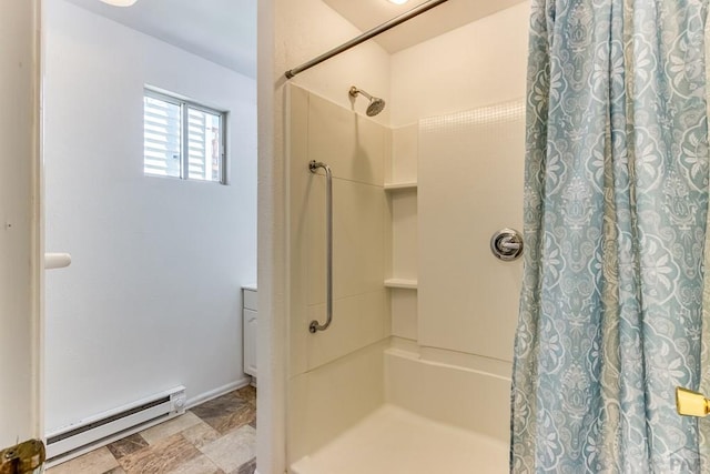 319 S Main St, La Veta, CO 81055 - full bath with a baseboard heating unit, a shower with shower curtain, stone finish floors, and baseboards
