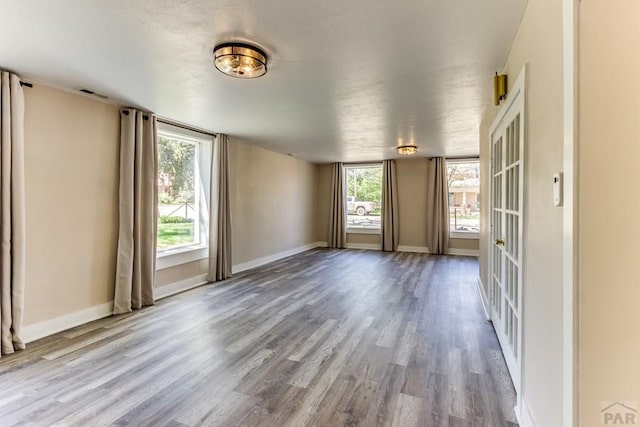 319 S Main St, La Veta, CO 81055 - unfurnished room featuring wood finished floors and baseboards