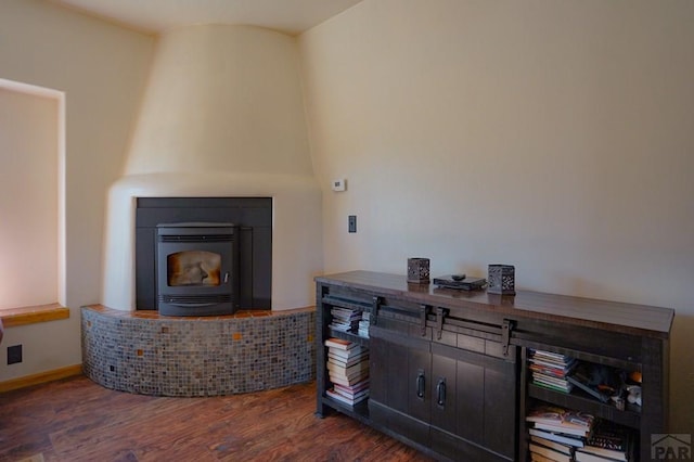 interior space featuring baseboards and wood finished floors