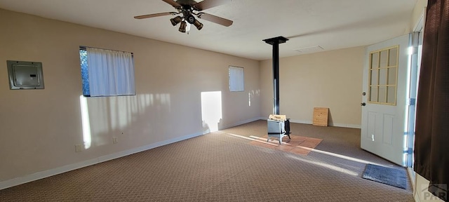 unfurnished room featuring ceiling fan, carpet flooring, visible vents, baseboards, and electric panel
