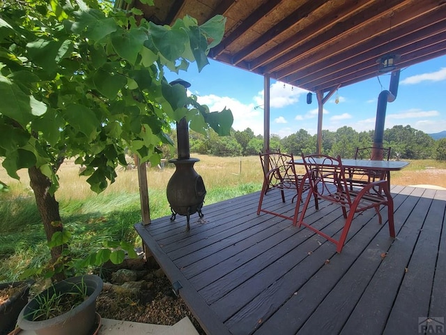 wooden deck with outdoor dining area