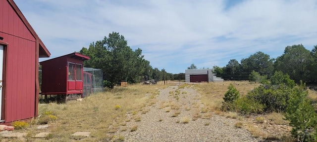 view of yard with an outdoor structure and exterior structure