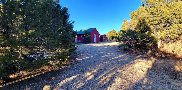 view of road featuring gravel driveway