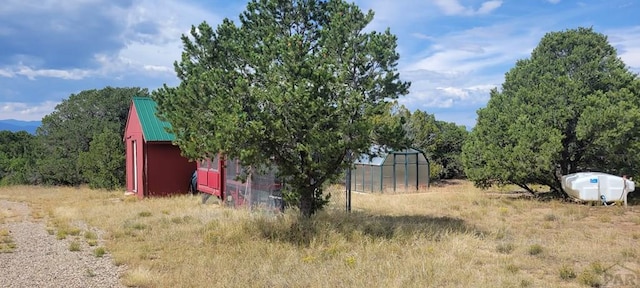 view of yard with an exterior structure and an outbuilding