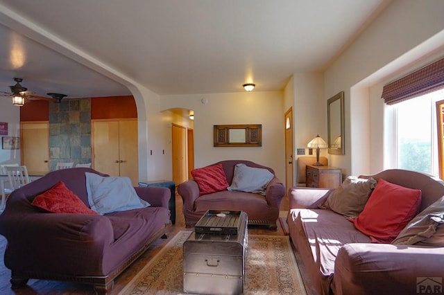 living room featuring arched walkways