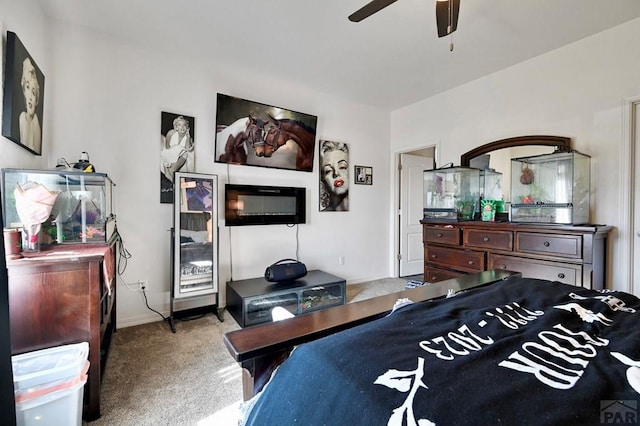 bedroom featuring light carpet and ceiling fan