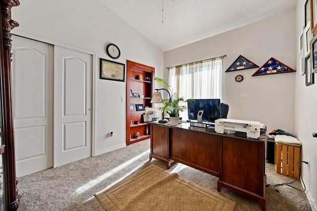 office area with light carpet and vaulted ceiling