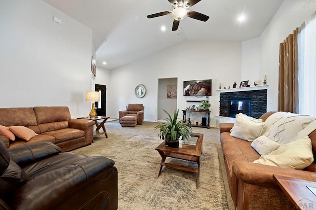 living area featuring high vaulted ceiling, a stone fireplace, a ceiling fan, baseboards, and carpet